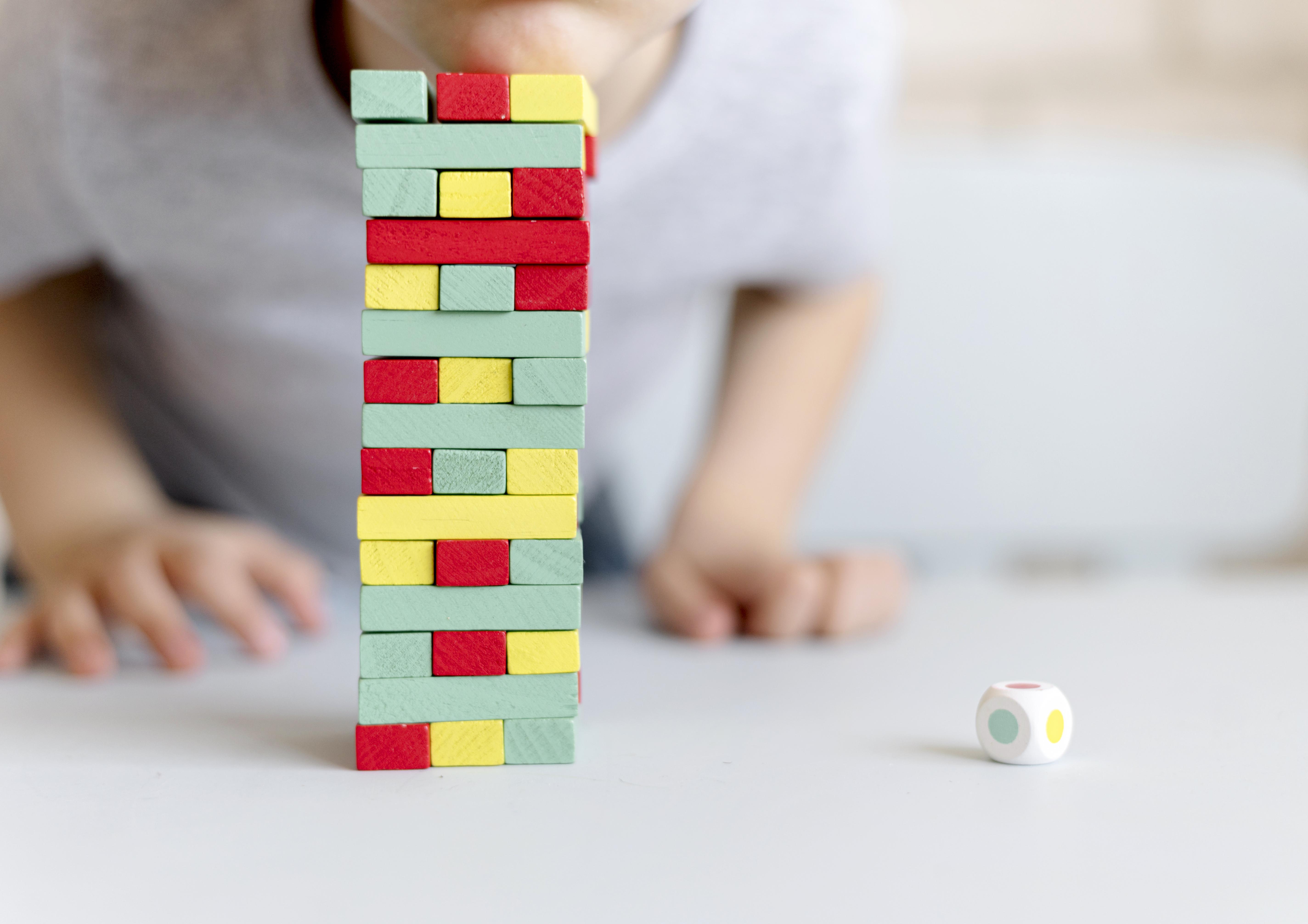 Kid playing jenga